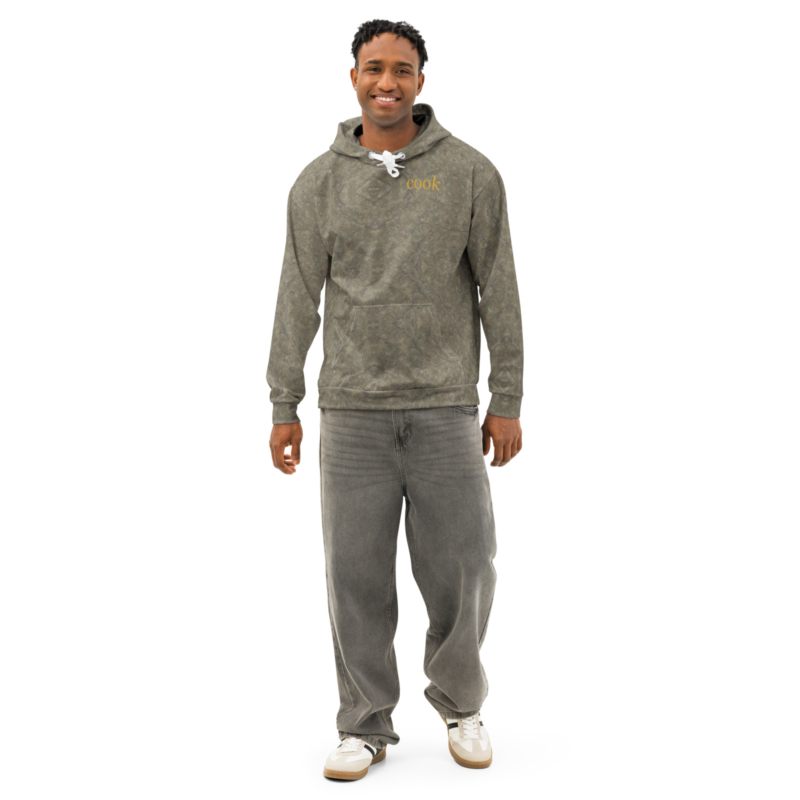 Cook Curated product image of the Cook all-over hoodie in muted realistic woodland camouflage with mustard wordmark
