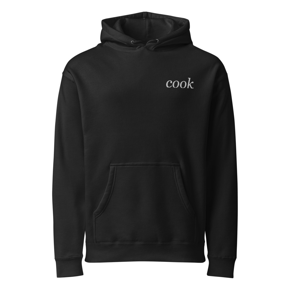 Black Independent IND4000 heavyweight hoodie with warm ivory cook embroidery at the left chest