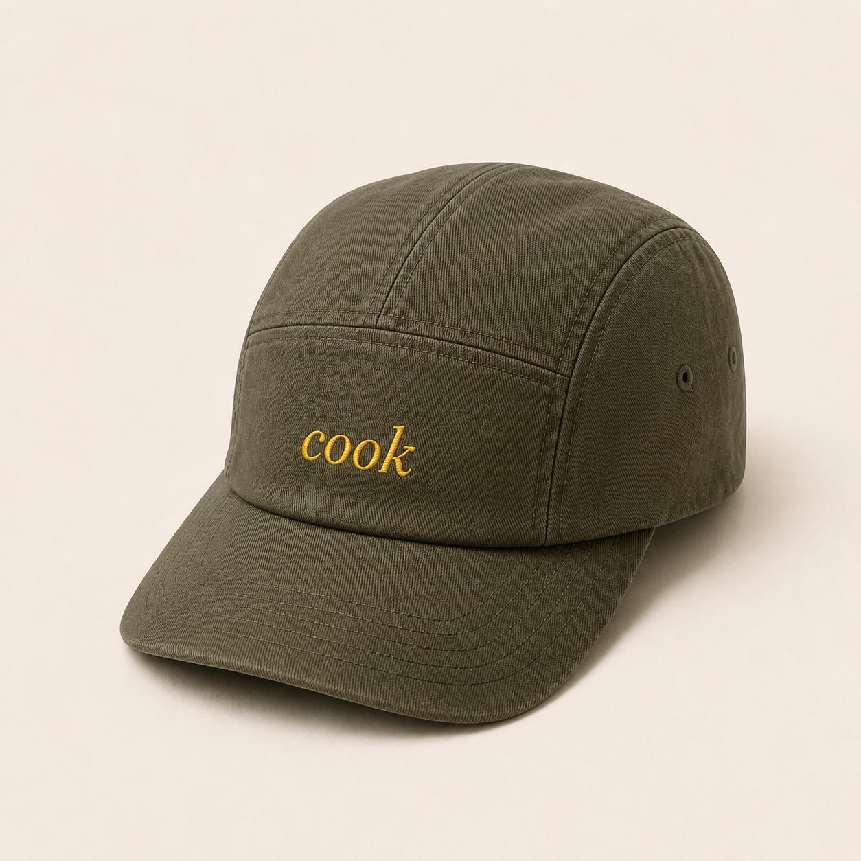 Olive five-panel cap with muted mustard cook embroidery