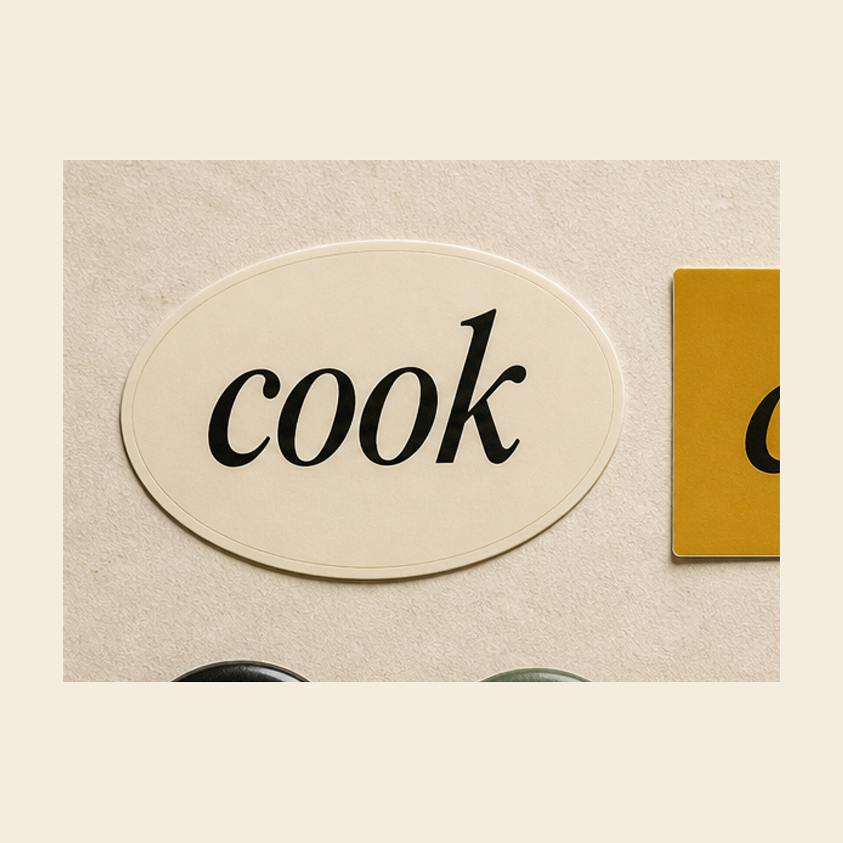 Ivory oval sticker with black cook wordmark